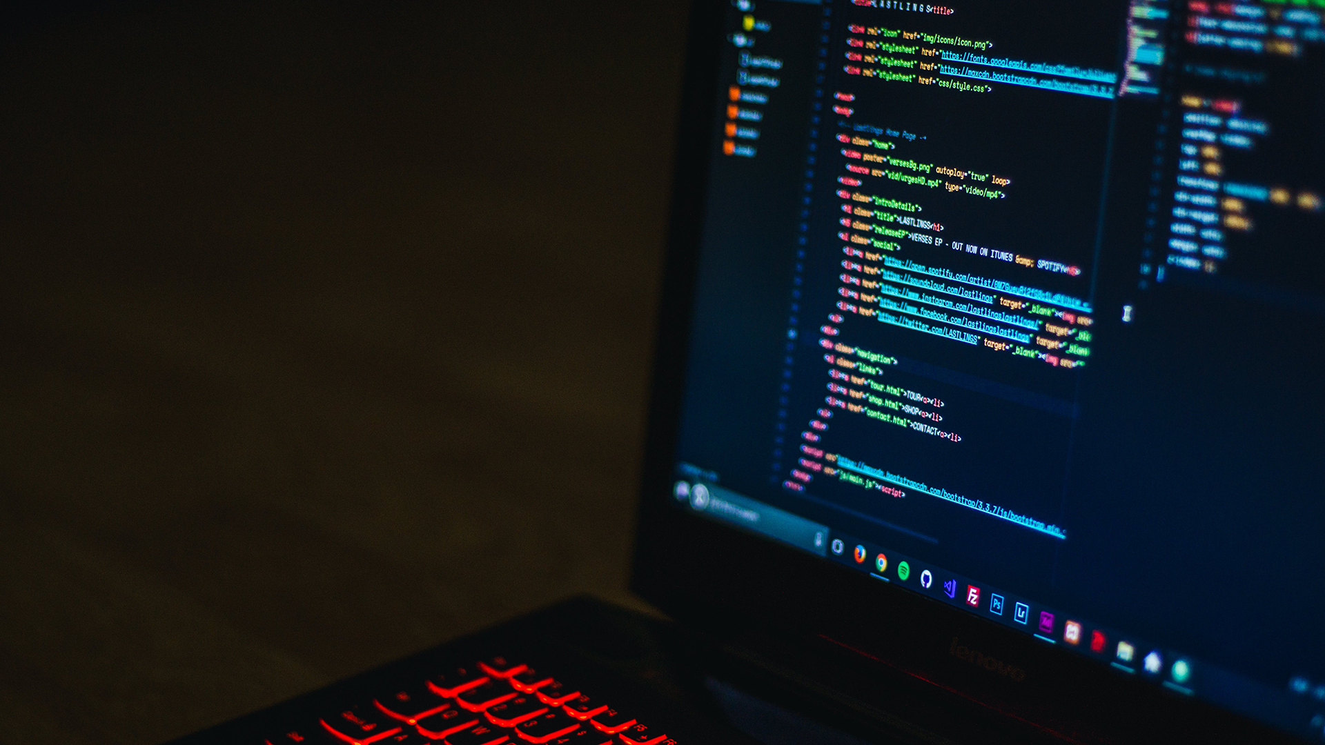 Laptop with html code being developed on the screen